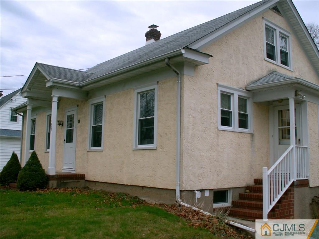 339 Plainsboro Road Plainsboro, NJ 08536 - Photo 2 of 16 a front view of a house with a yard
