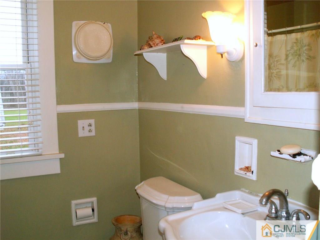 339 Plainsboro Road Plainsboro, NJ 08536 - Photo 12 of 16 a bathroom with a sink and a toilet