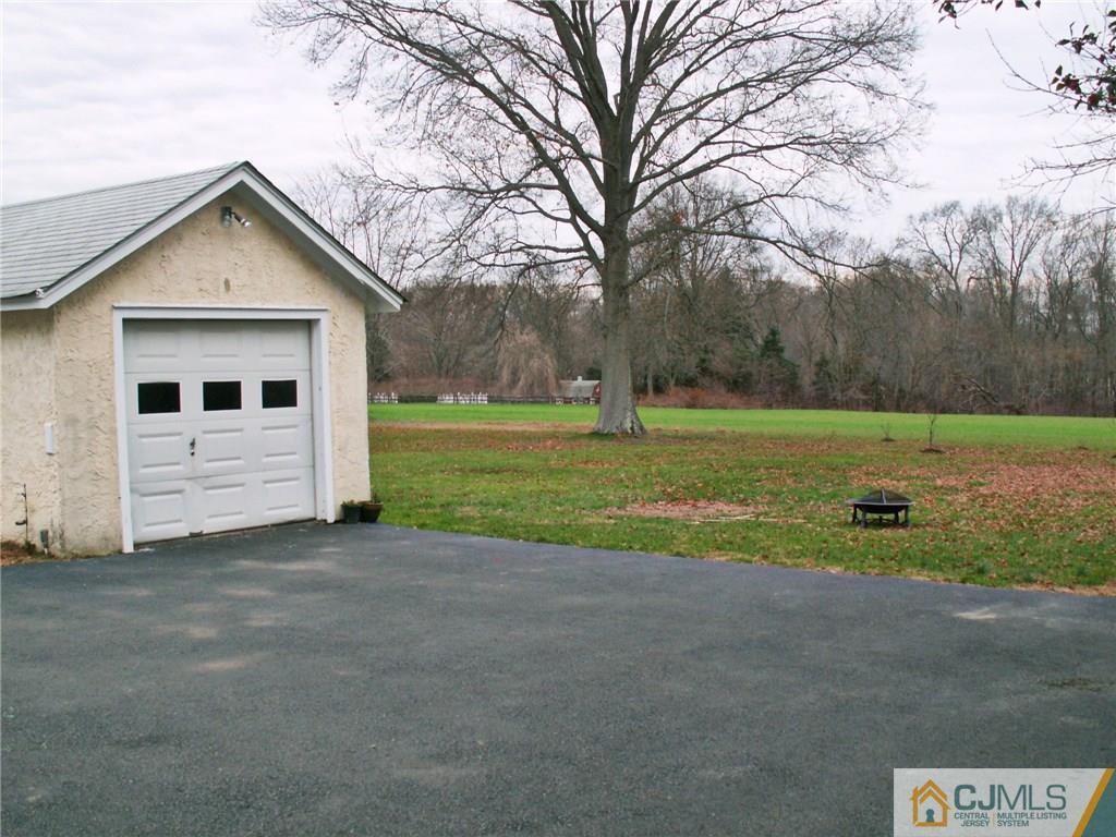 339 Plainsboro Road Plainsboro, NJ 08536 - Photo 15 of 16 a view of a house with backyard and trees