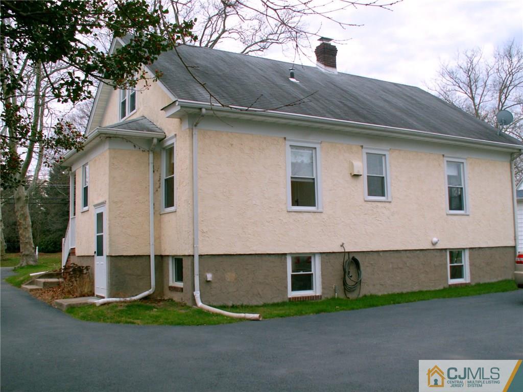 339 Plainsboro Road Plainsboro, NJ 08536 - Photo 16 of 16 a front view of a house with garden