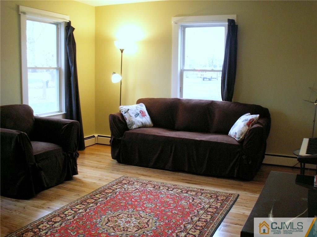 339 Plainsboro Road Plainsboro, NJ 08536 - Photo 3 of 16 a living room with a couch and a coffee table