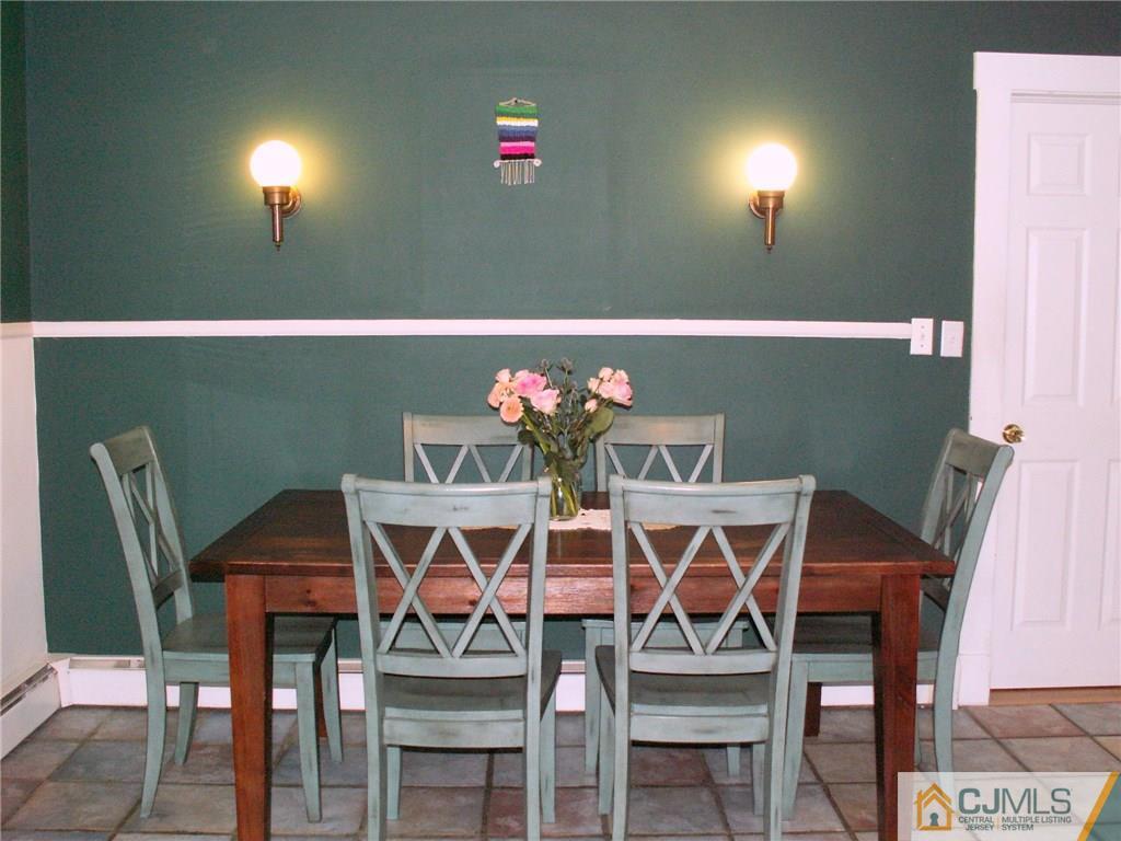 339 Plainsboro Road Plainsboro, NJ 08536 - Photo 5 of 16 a view of a dining room with furniture and chandelier