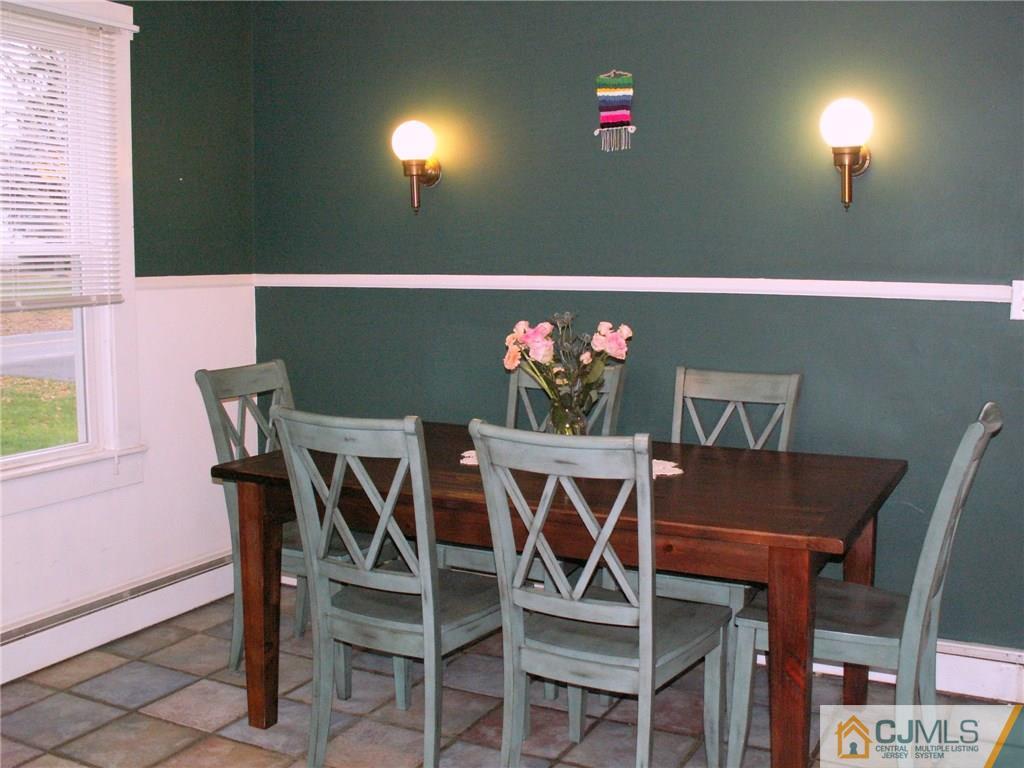 339 Plainsboro Road Plainsboro, NJ 08536 - Photo 6 of 16 a view of a dining room with furniture and wooden floor