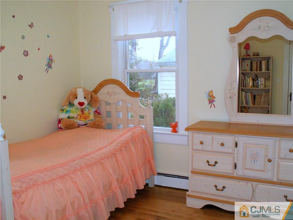 339 Plainsboro Road Plainsboro, NJ 08536 - Photo 9 of 16 a bedroom with bed and wooden floor