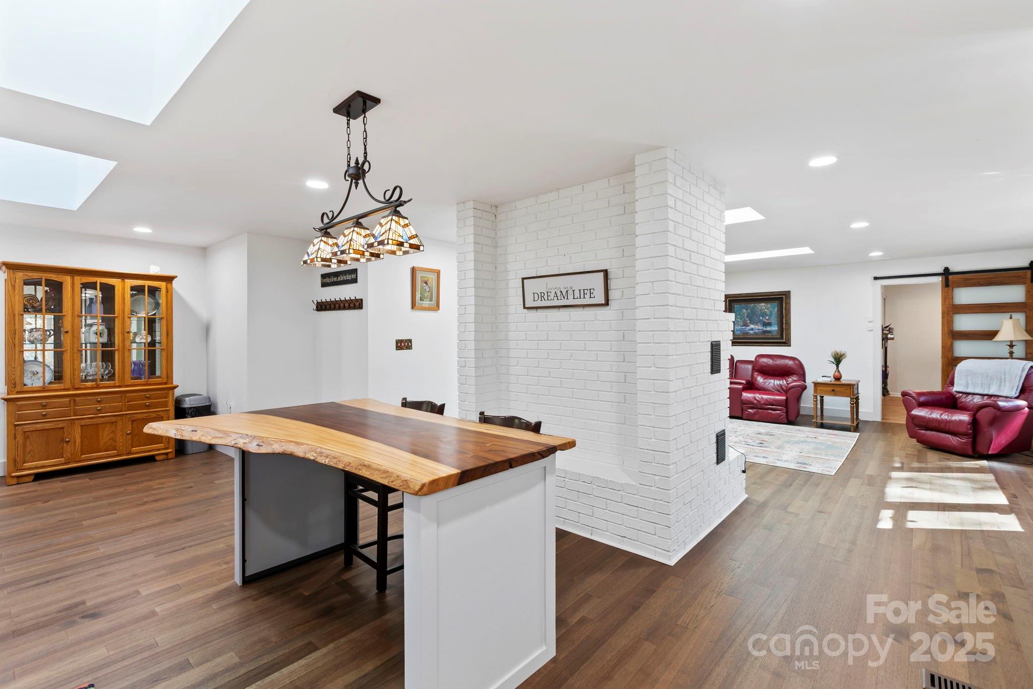 2149 Williamson Creek Road Pisgah Forest, NC 28768 - Photo 12 of 38 a view of a dining room with furniture and window