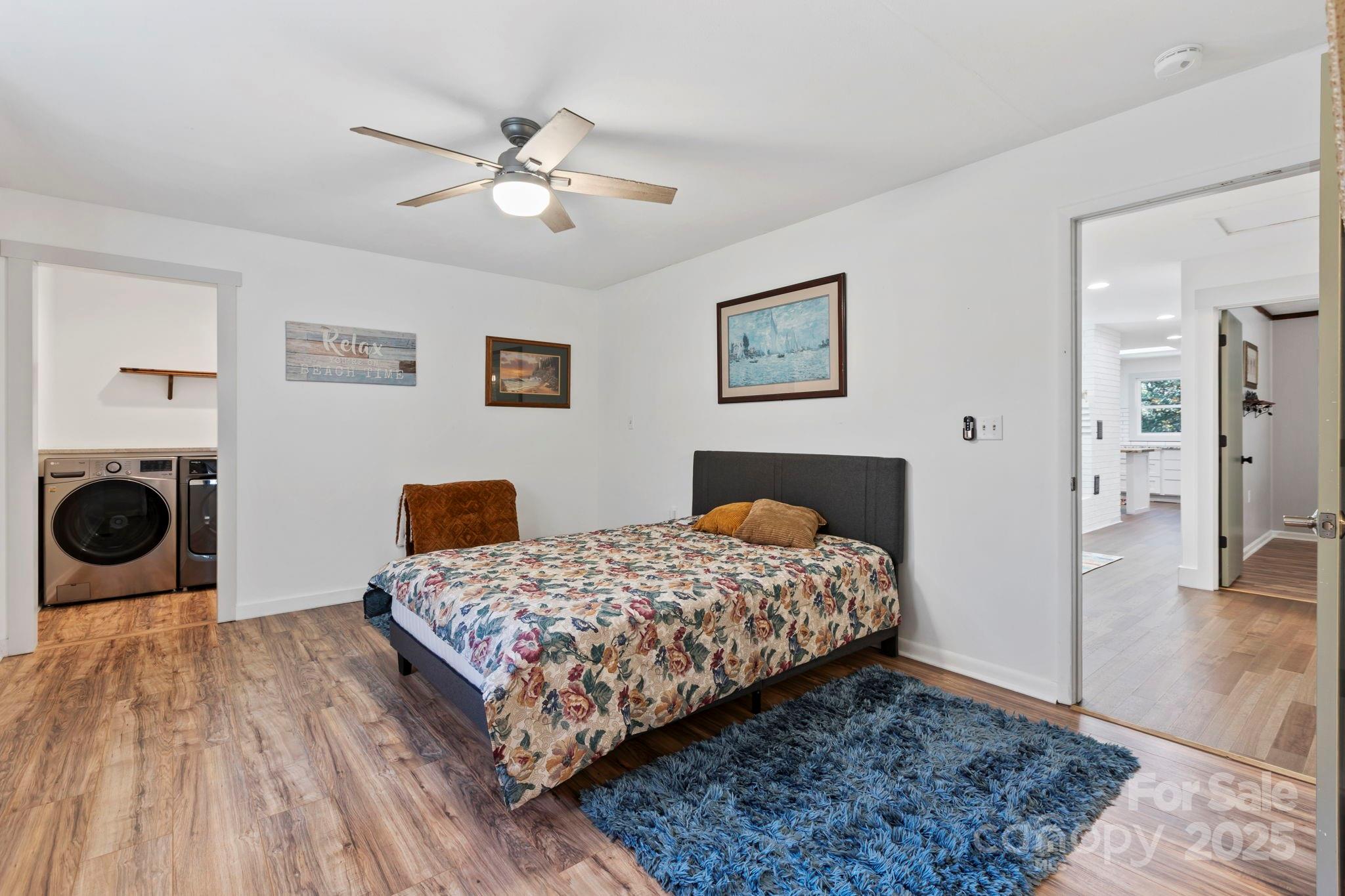 2149 Williamson Creek Road Pisgah Forest, NC 28768 - Photo 15 of 38 a bedroom with a bed and a view of bathroom