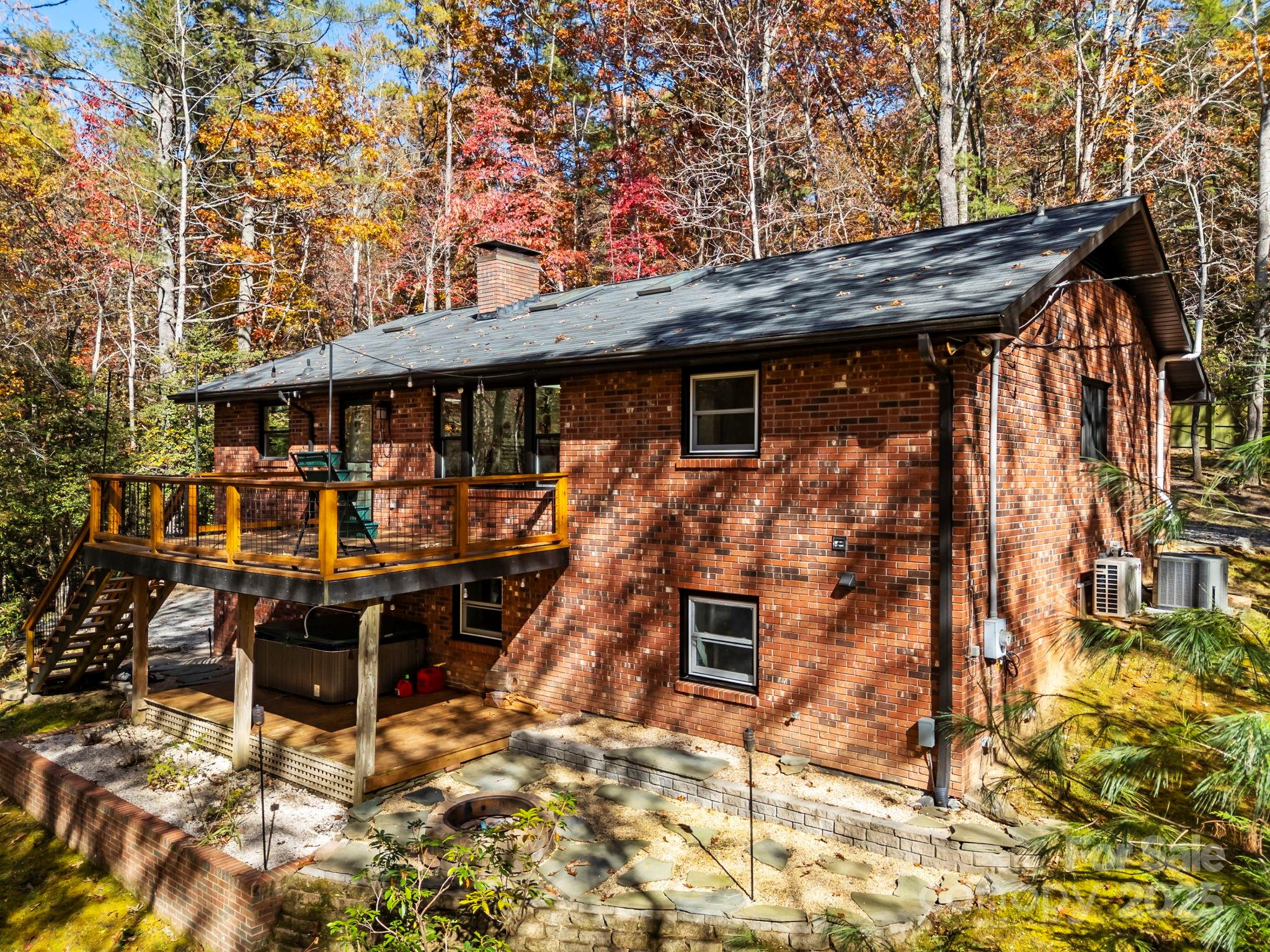 2149 Williamson Creek Road Pisgah Forest, NC 28768 - Photo 2 of 38 a view of house with outdoor seating space