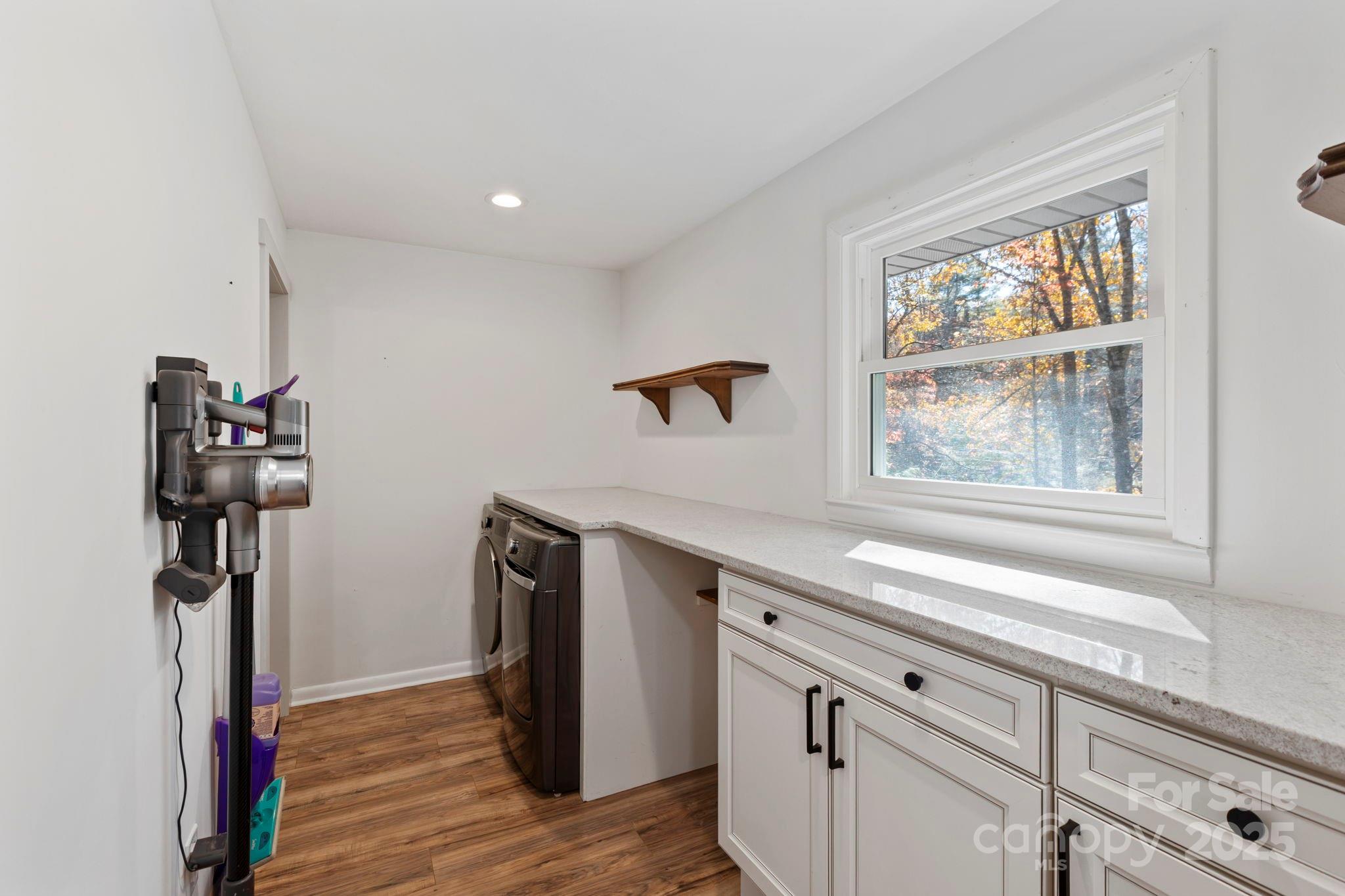 2149 Williamson Creek Road Pisgah Forest, NC 28768 - Photo 23 of 38 a view of a livingroom with wooden floor and a window