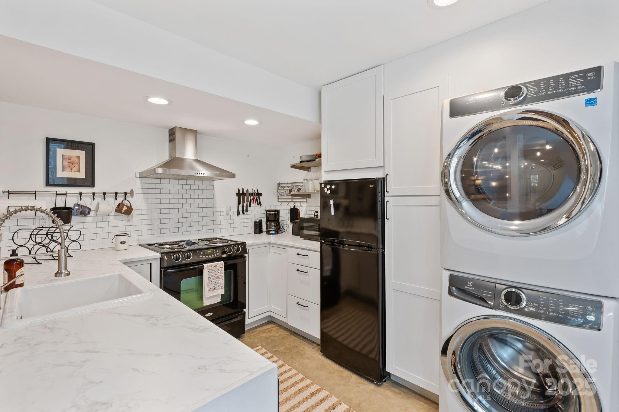 2149 Williamson Creek Road Pisgah Forest, NC 28768 - Photo 29 of 38 a view of kitchen sink stove and refrigerator