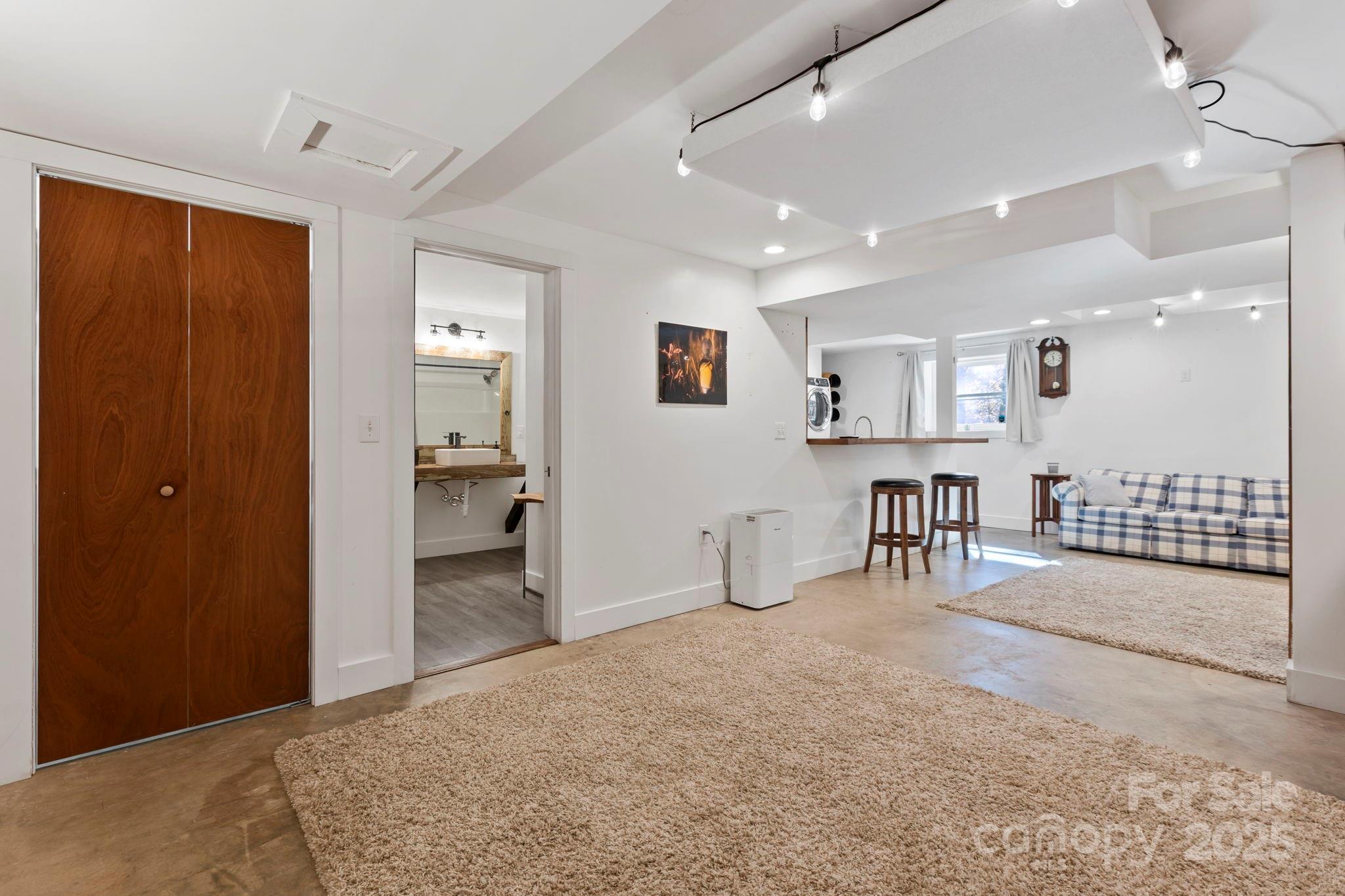 2149 Williamson Creek Road Pisgah Forest, NC 28768 - Photo 32 of 38 a view of a bedroom with furniture and window
