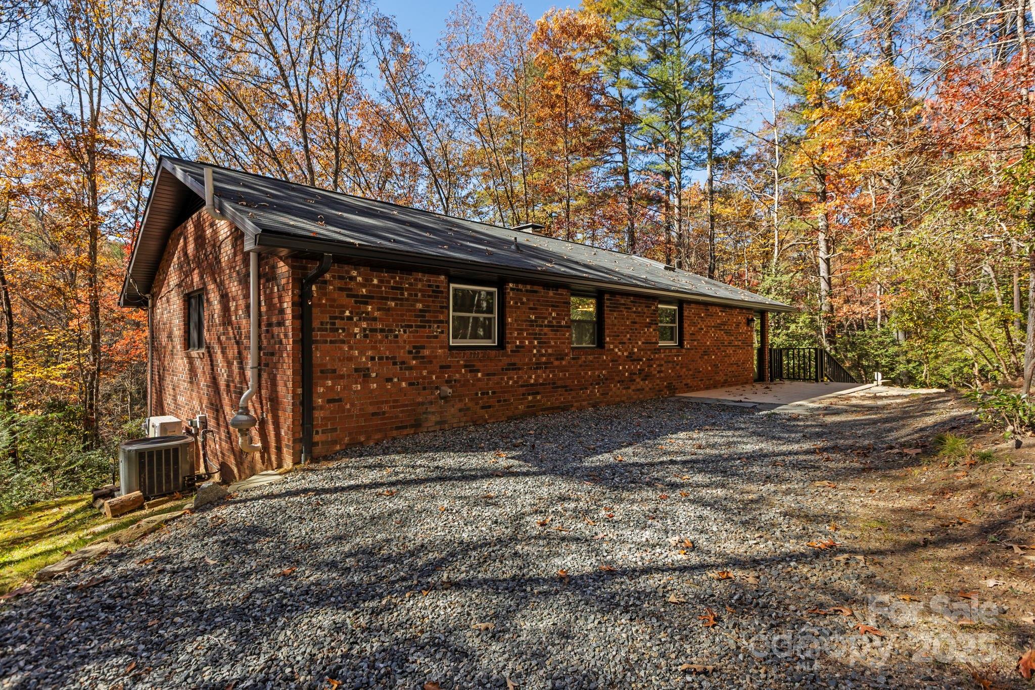 2149 Williamson Creek Road Pisgah Forest, NC 28768 - Photo 4 of 38 a view of a house with a yard