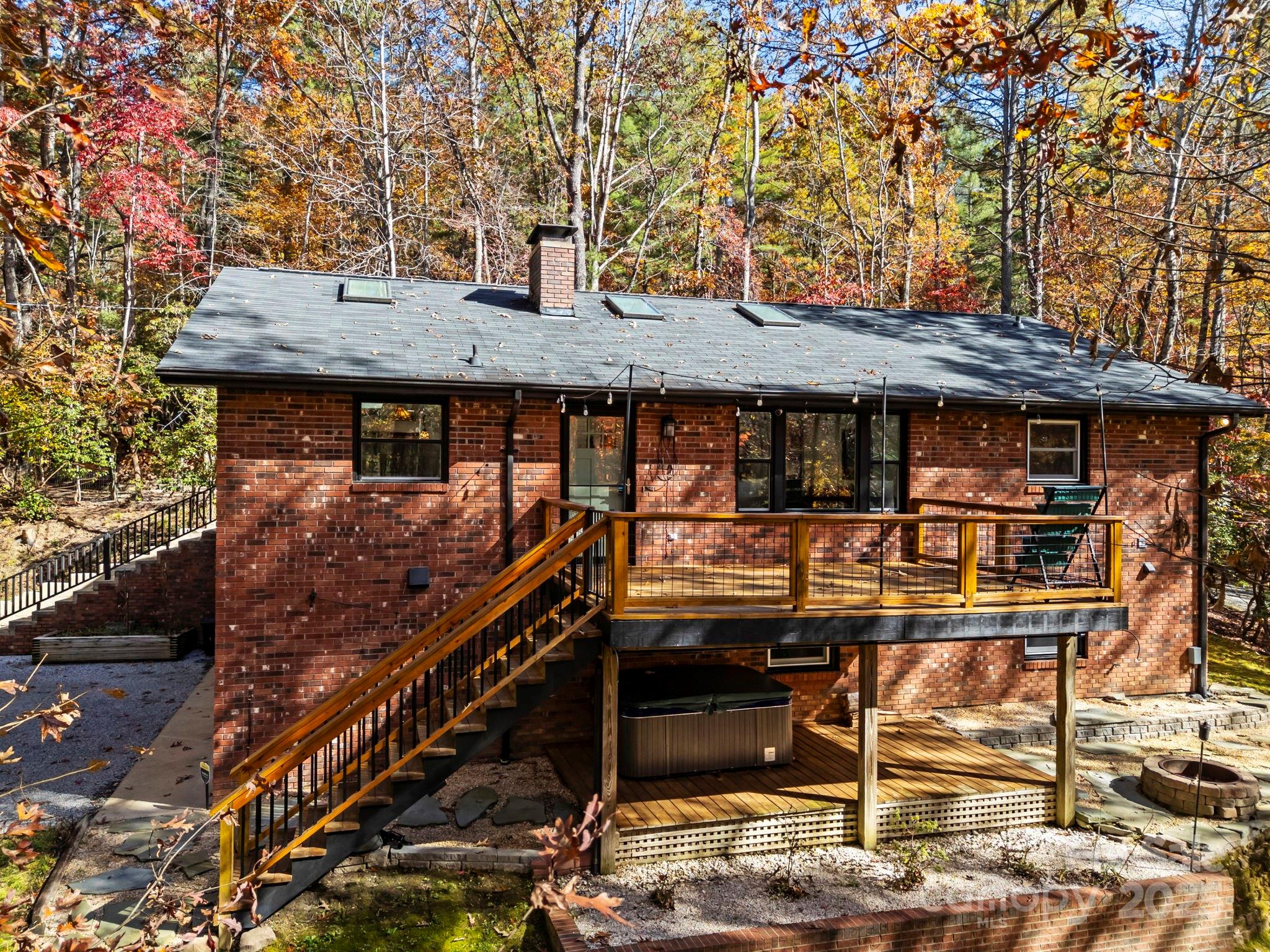 2149 Williamson Creek Road Pisgah Forest, NC 28768 - Photo 5 of 38 a front view of a house with balcony