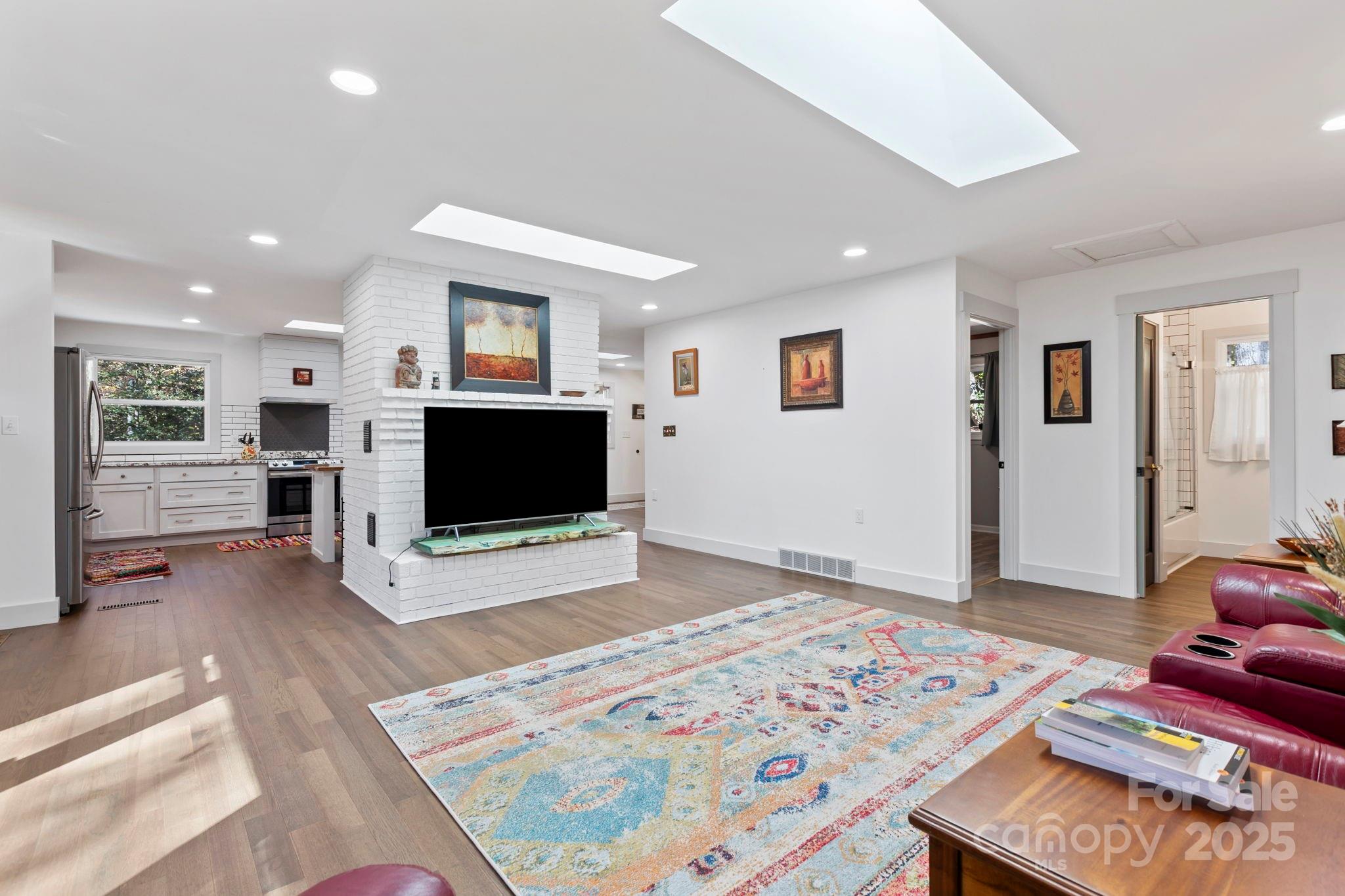 2149 Williamson Creek Road Pisgah Forest, NC 28768 - Photo 7 of 38 a living room with furniture and a flat screen tv