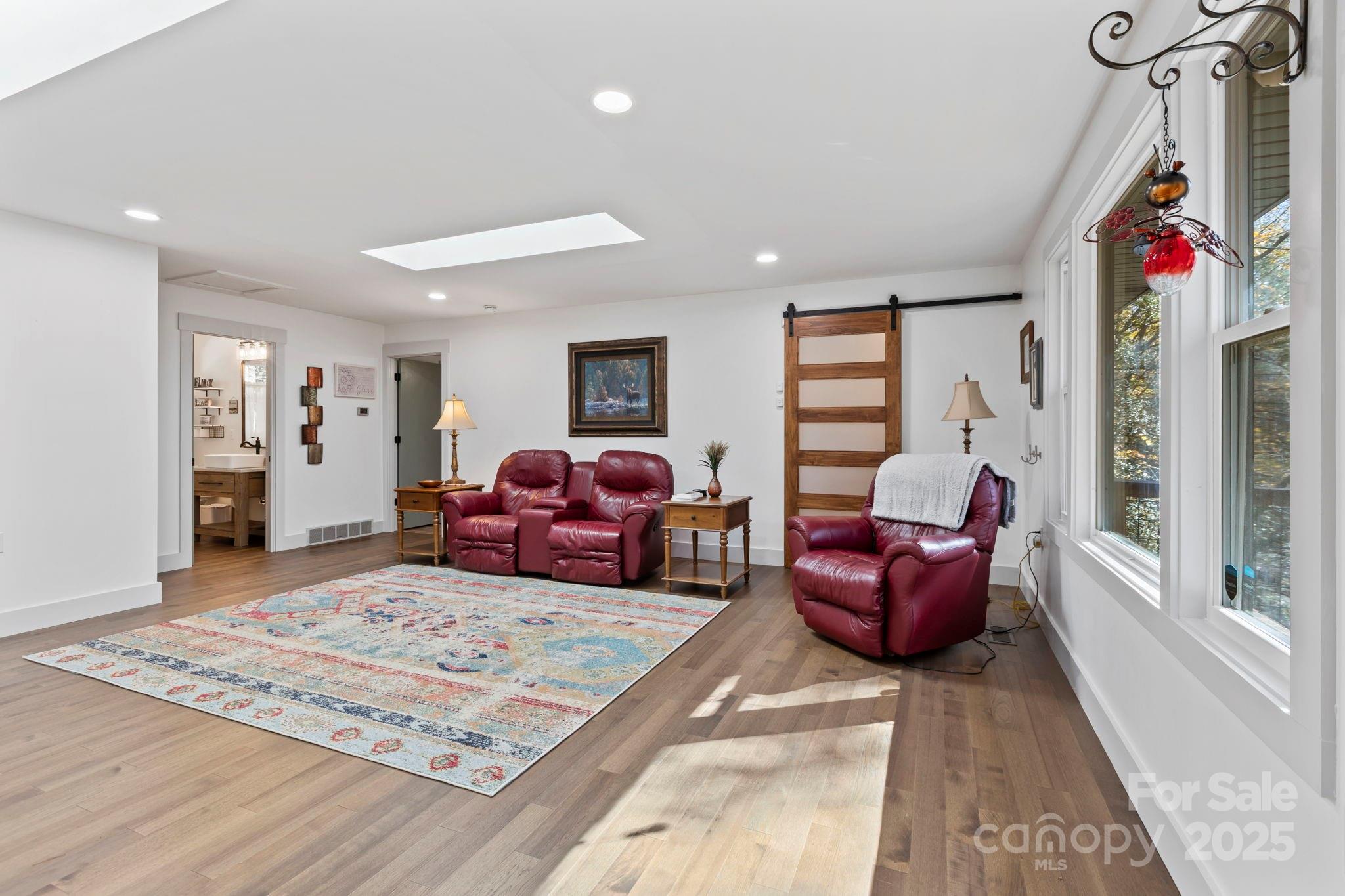 2149 Williamson Creek Road Pisgah Forest, NC 28768 - Photo 10 of 38 a bedroom with furniture window and couch