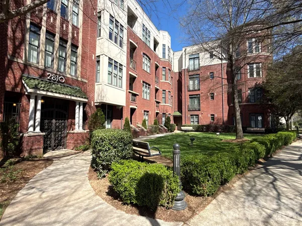 a view of a building with a yard