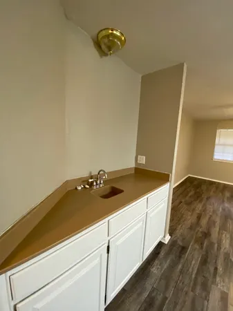 a bathroom with a sink and vanity