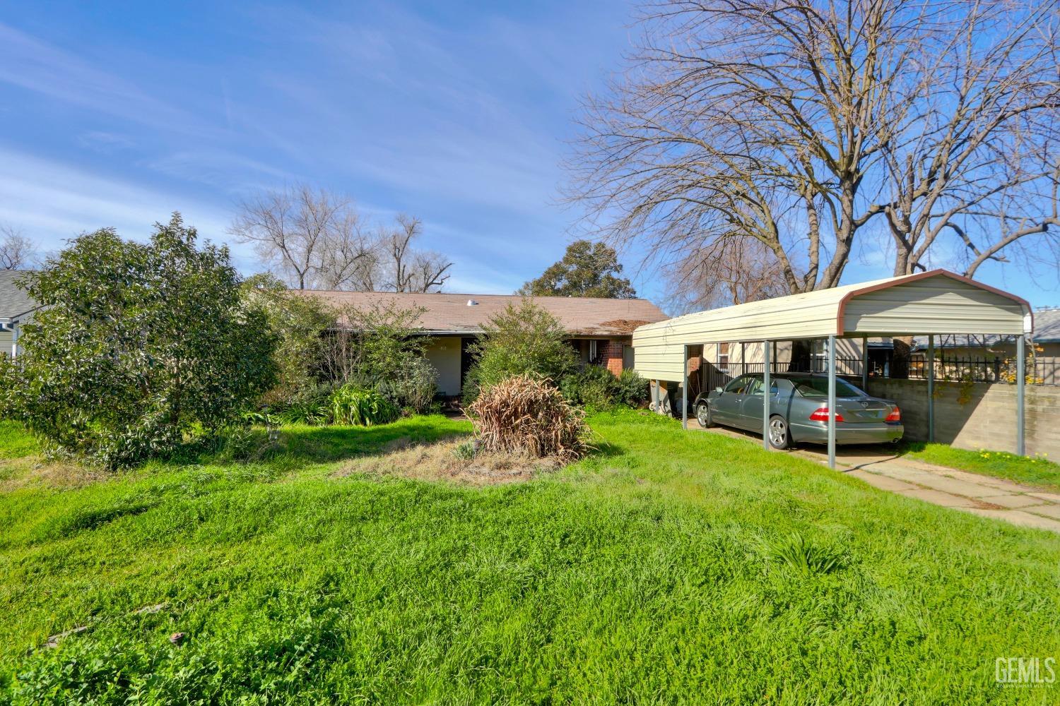 Undisclosed Address Sacramento, CA 95821 - Photo 1 of 33 a front view of a house with garden and sitting area