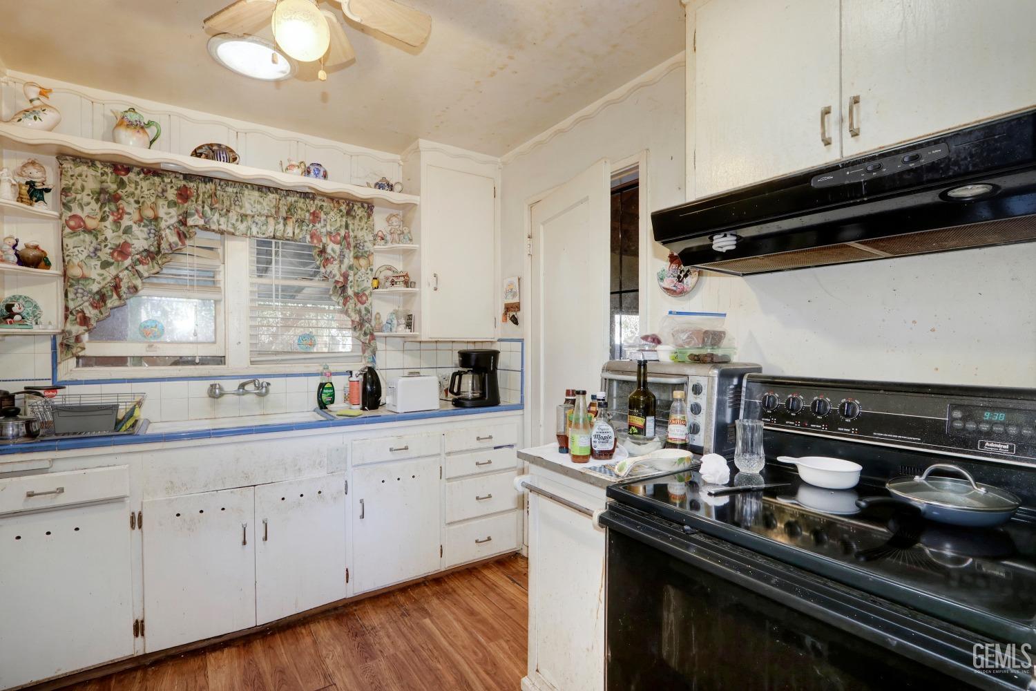 Undisclosed Address Sacramento, CA 95821 - Photo 13 of 33 a kitchen with a sink stove and cabinets