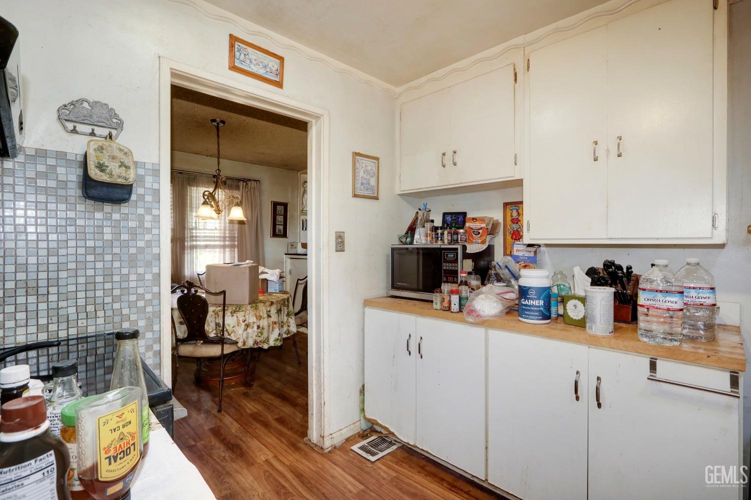 Undisclosed Address Sacramento, CA 95821 - Photo 15 of 33 a kitchen with a sink cabinets and wooden floor
