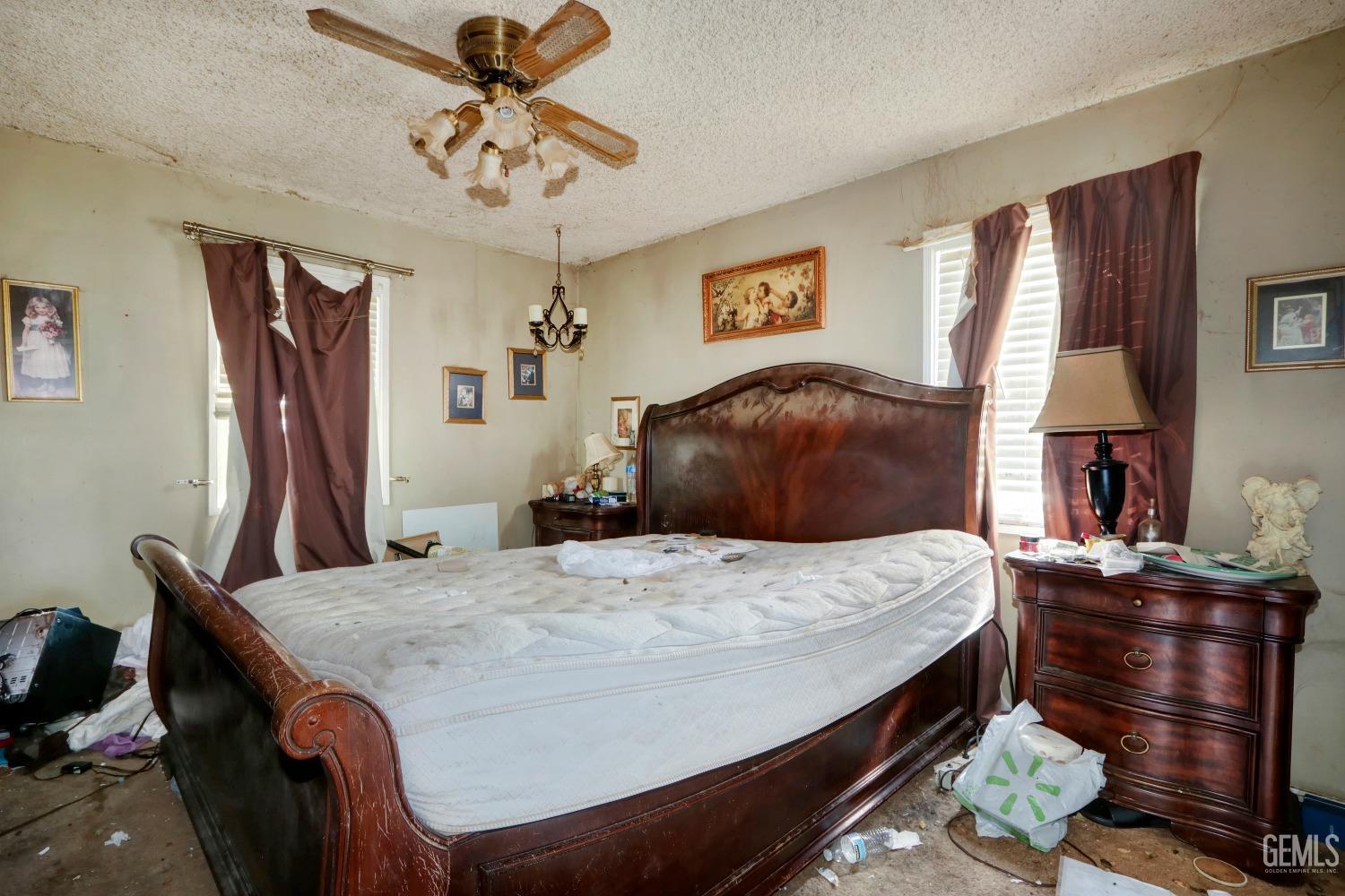 Undisclosed Address Sacramento, CA 95821 - Photo 22 of 33 a bedroom with a bed and a chandelier