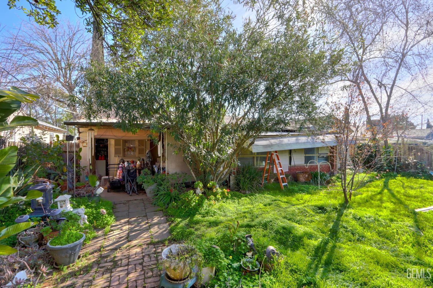 Undisclosed Address Sacramento, CA 95821 - Photo 30 of 33 a view of a house with garden and a trees
