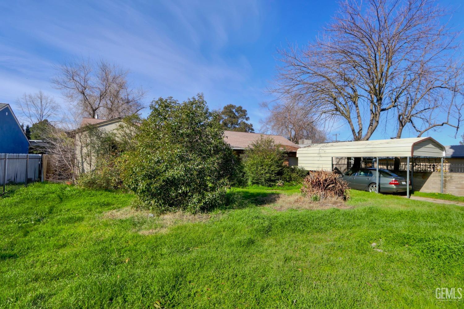 Undisclosed Address Sacramento, CA 95821 - Photo 33 of 33 a view of a yard with table and chairs under an umbrella