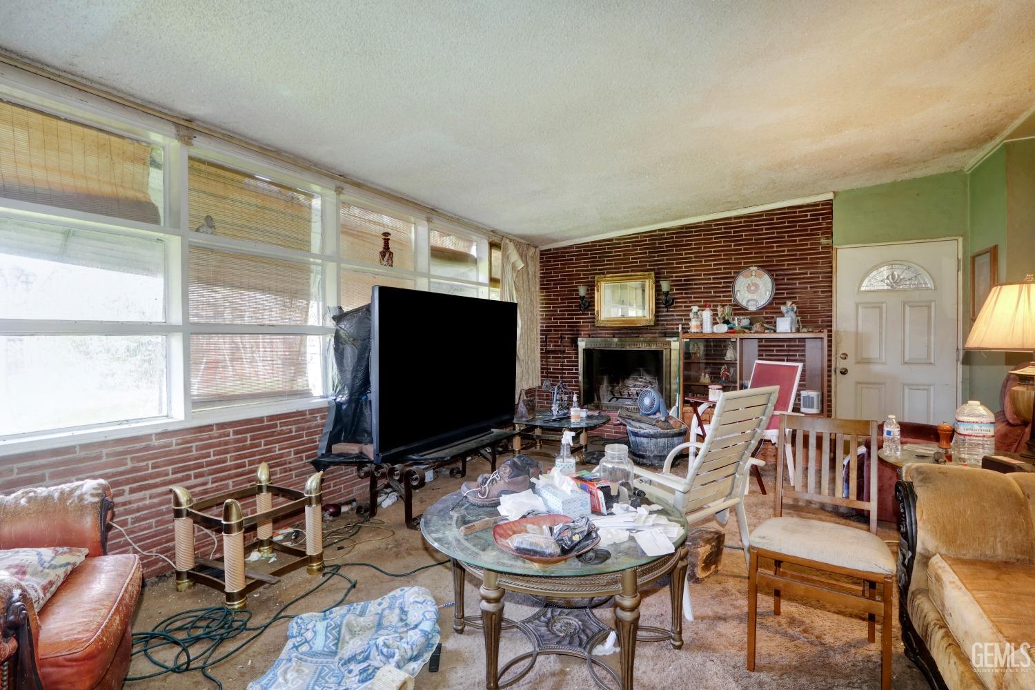 Undisclosed Address Sacramento, CA 95821 - Photo 5 of 33 a living room with furniture a flat screen tv and a large window