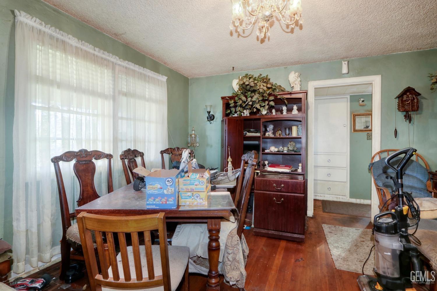 Undisclosed Address Sacramento, CA 95821 - Photo 10 of 33 a view of a dining room with furniture window and wooden floor
