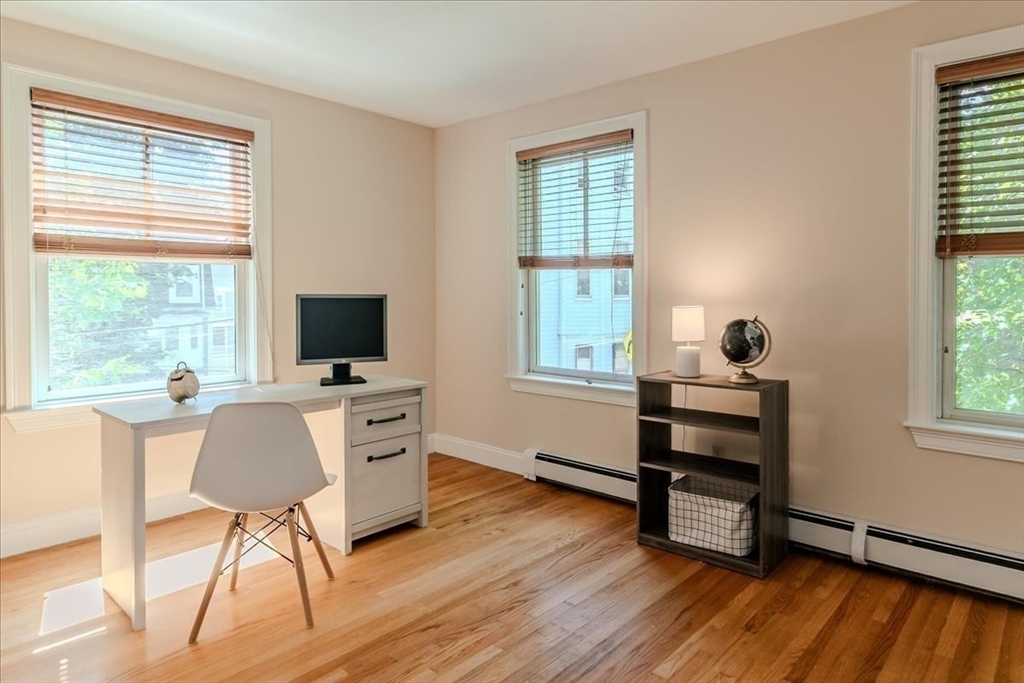 59 Fulda Street, Unit A Boston, MA 02119 - Photo 11 of 18 a view of a workspace with furniture and a window