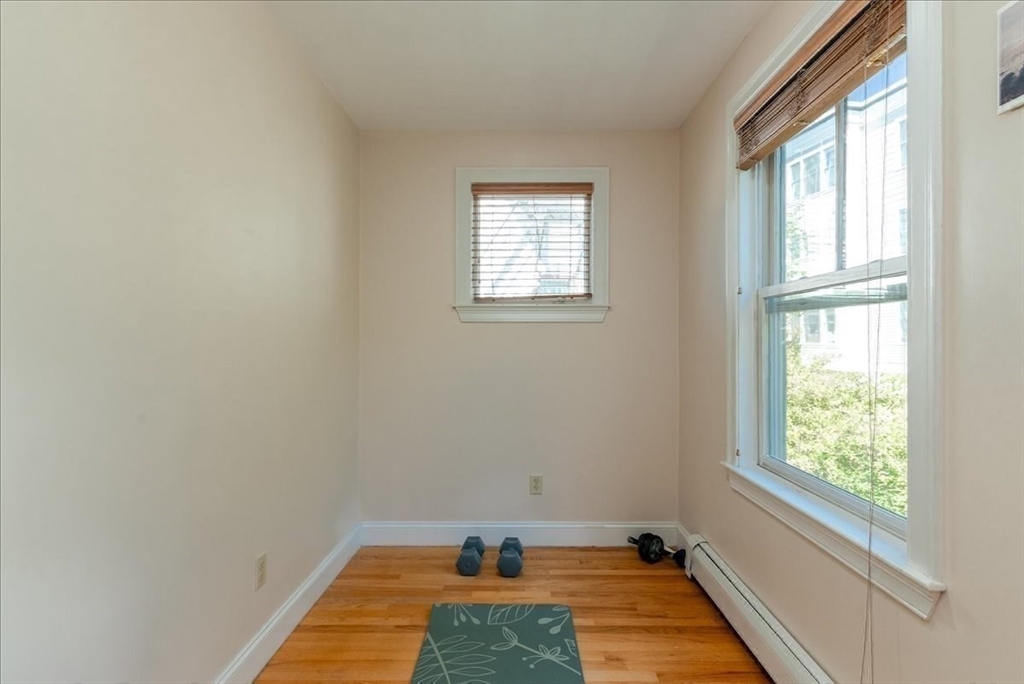 59 Fulda Street, Unit A Boston, MA 02119 - Photo 13 of 18 an empty room with a window