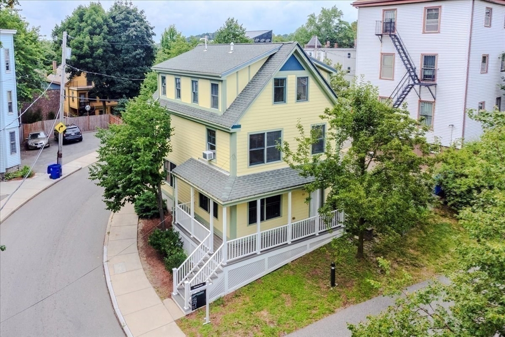 59 Fulda Street, Unit A Boston, MA 02119 - Photo 17 of 18 a front view of a house with a yard