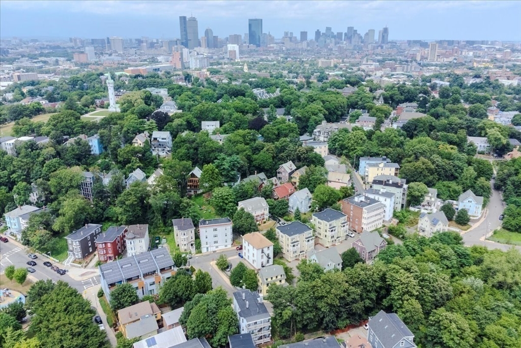 59 Fulda Street, Unit A Boston, MA 02119 - Photo 18 of 18 an aerial view of multiple house with yard and outdoor seating