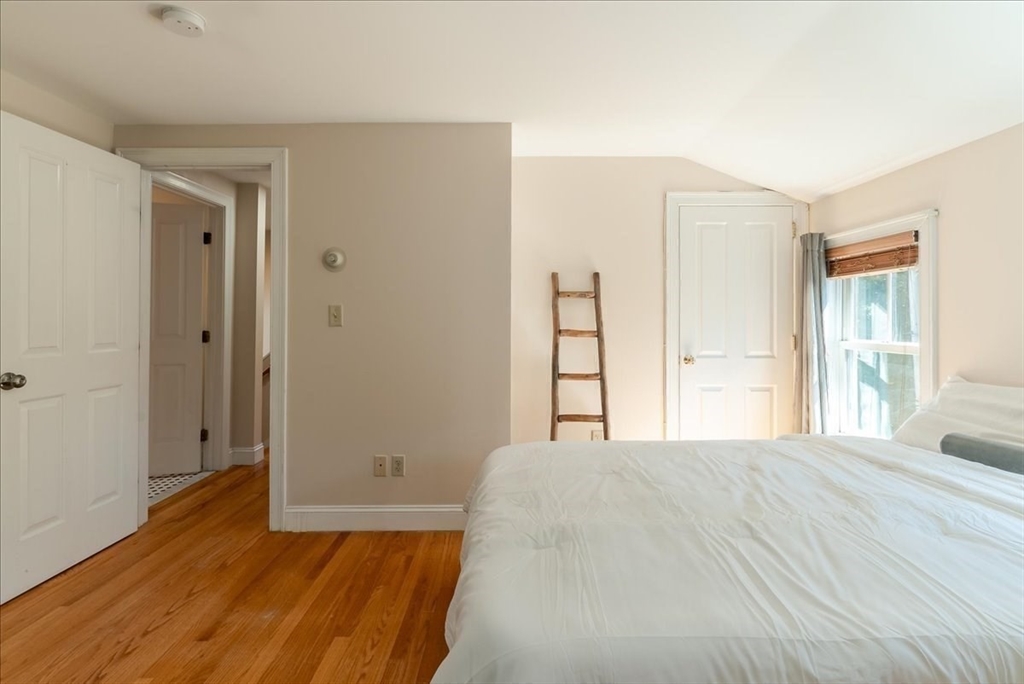59 Fulda Street, Unit A Boston, MA 02119 - Photo 6 of 18 a bedroom with a bed and a window