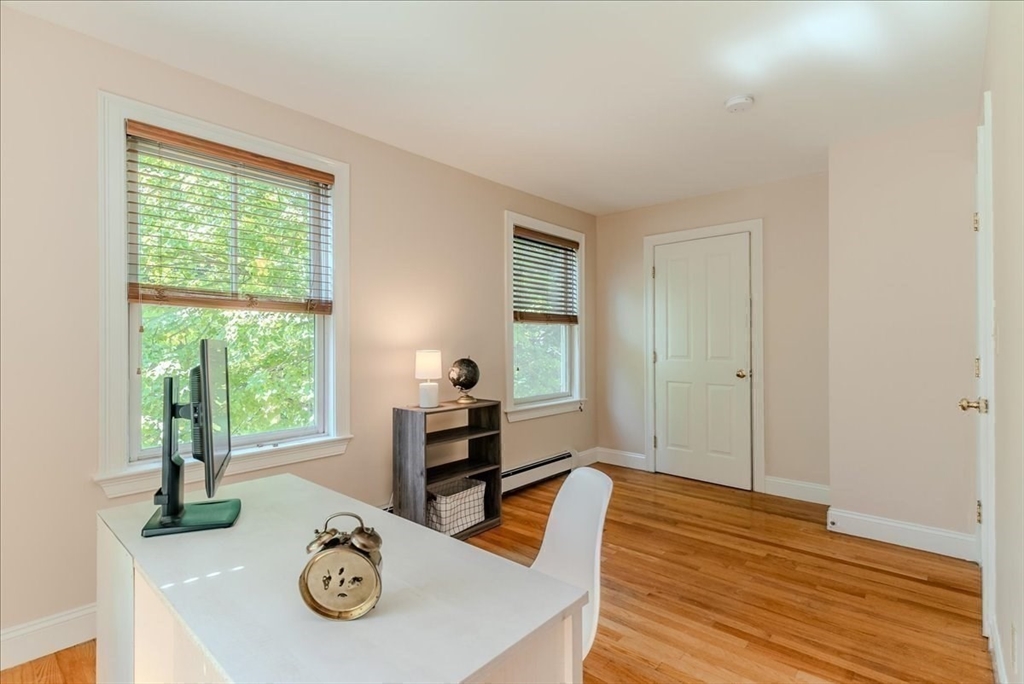 59 Fulda Street, Unit A Boston, MA 02119 - Photo 10 of 18 a living room with furniture and next to a window