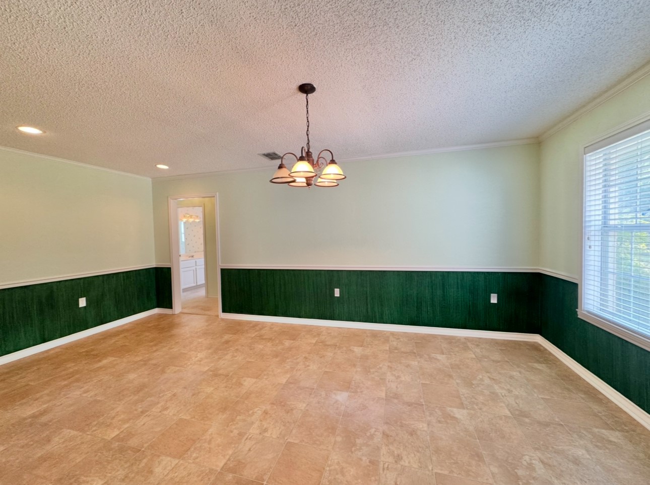 608 Mogonye Lane Elgin, TX 78621 - Photo 14 of 38 a view of a room with a chandelier fan and a window