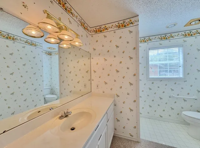 a bathroom with a double vanity sink and mirror