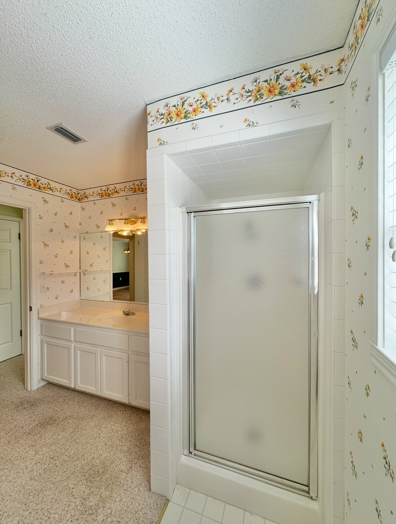 608 Mogonye Lane Elgin, TX 78621 - Photo 18 of 38 a bathroom with a double vanity sink and mirror