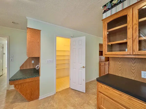 an empty room with closet area
