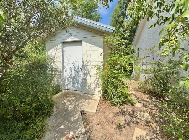 a house with trees in front of it