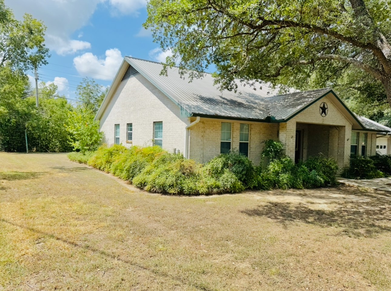 608 Mogonye Lane Elgin, TX 78621 - Photo 5 of 38 a view of a house with a small yard and potted plants