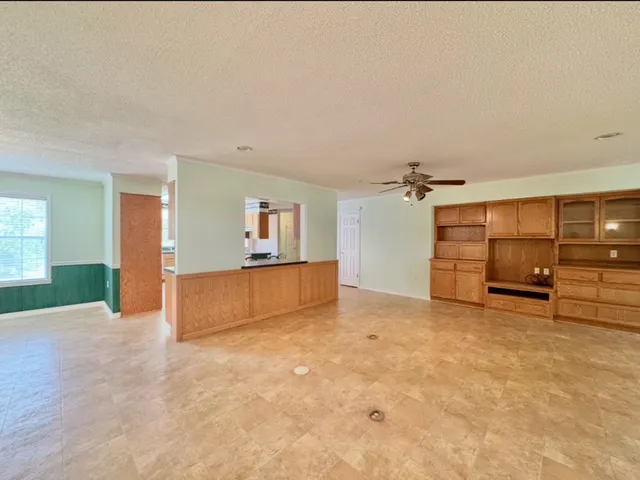 a view of a kitchen with a sink and a kitchen view