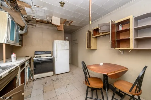 a view of an entryway with a kitchen