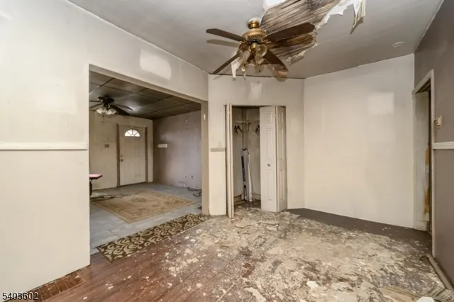 a kitchen with a table chairs microwave and cabinets
