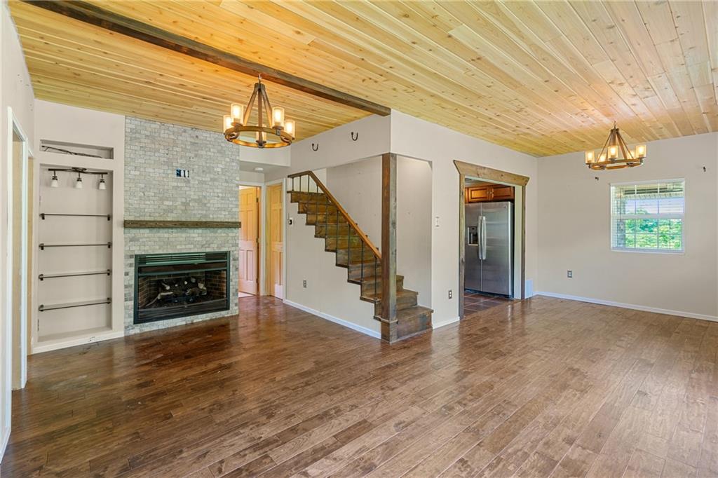 635 Center New Texas Road Pittsburgh, PA 15239 - Photo 13 of 22 a view of an empty room with wooden floor fireplace and a window