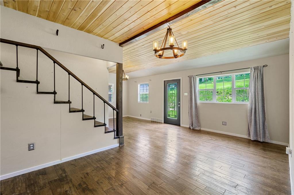 635 Center New Texas Road Pittsburgh, PA 15239 - Photo 14 of 22 a view of an empty room with wooden floor and a window
