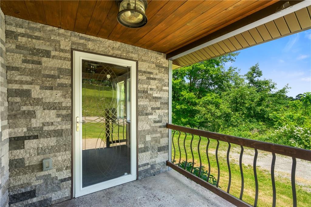 635 Center New Texas Road Pittsburgh, PA 15239 - Photo 4 of 22 a view of a glass door with a balcony