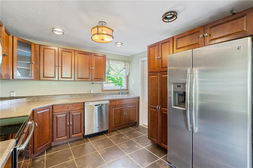 635 Center New Texas Road Pittsburgh, PA 15239 - Photo 6 of 22 a kitchen with stainless steel appliances granite countertop a refrigerator and a sink