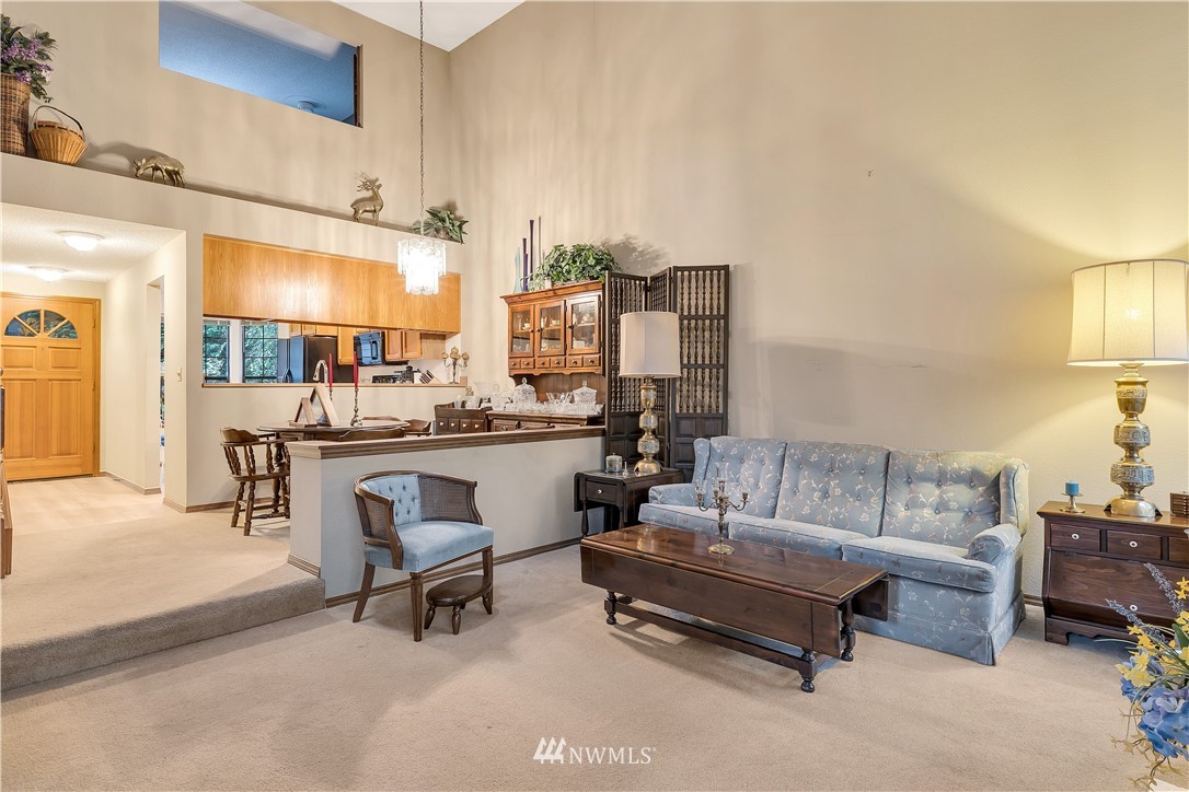 25419 213th Place Southeast, Unit 60 Maple Valley, WA 98038 - Photo 14 of 27 a living room with furniture and a table