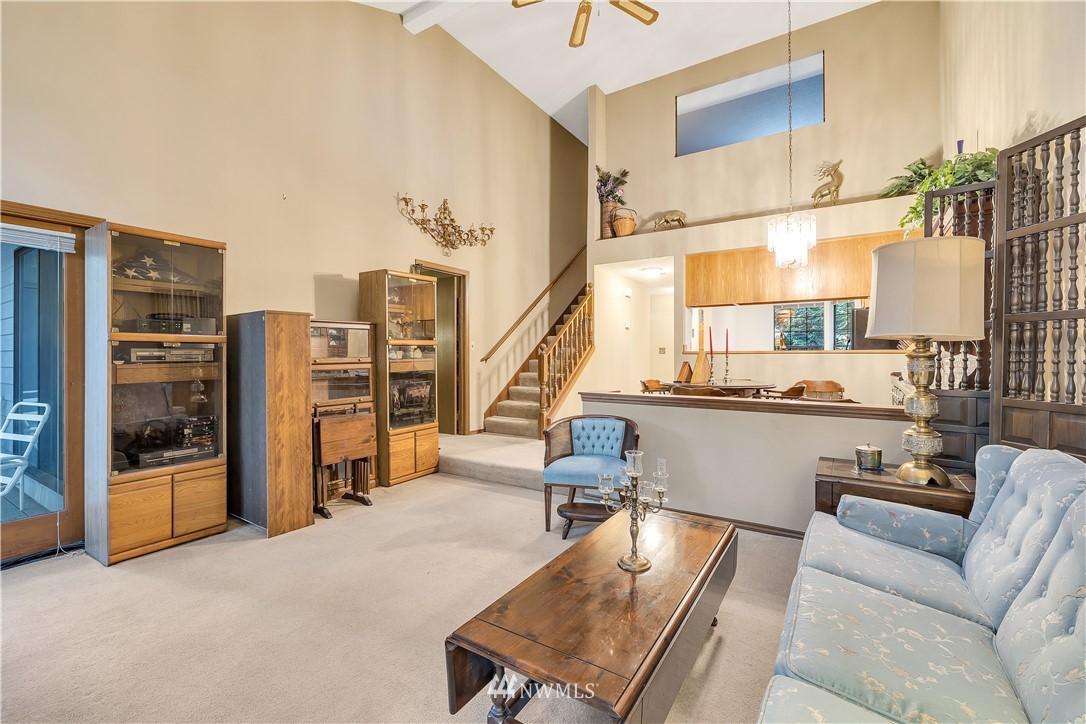 25419 213th Place Southeast, Unit 60 Maple Valley, WA 98038 - Photo 15 of 27 a living room with furniture and large windows