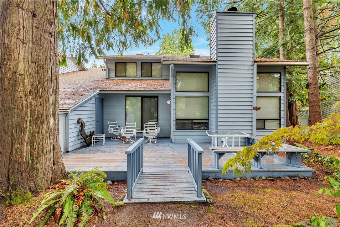 25419 213th Place Southeast, Unit 60 Maple Valley, WA 98038 - Photo 3 of 27 a front view of a house with garden